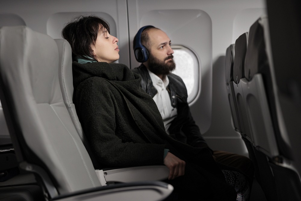 woman sleeping in a plane